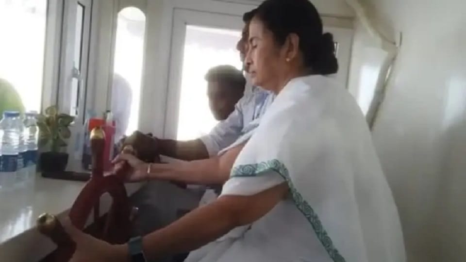 cm Mamta Banerjee drives a boat in Ichamati river