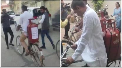 गुजरात में साइकिल पर सिलेंडर लेकर वोट डालने पहुंचे कांग्रेस उम्मीदवार