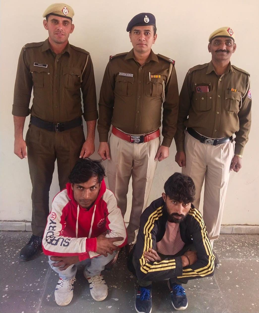 Two accused arrested for snatching phone from shopkeeper and his son