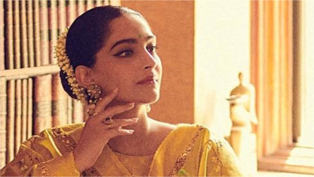 sonam kapoor yellow anarkali suit with green bindi and gajra look simply wow