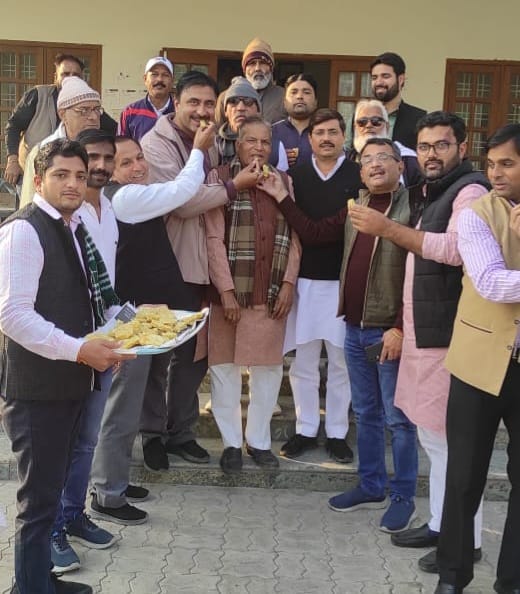 RLD distributed sweets on the victory in the by-election