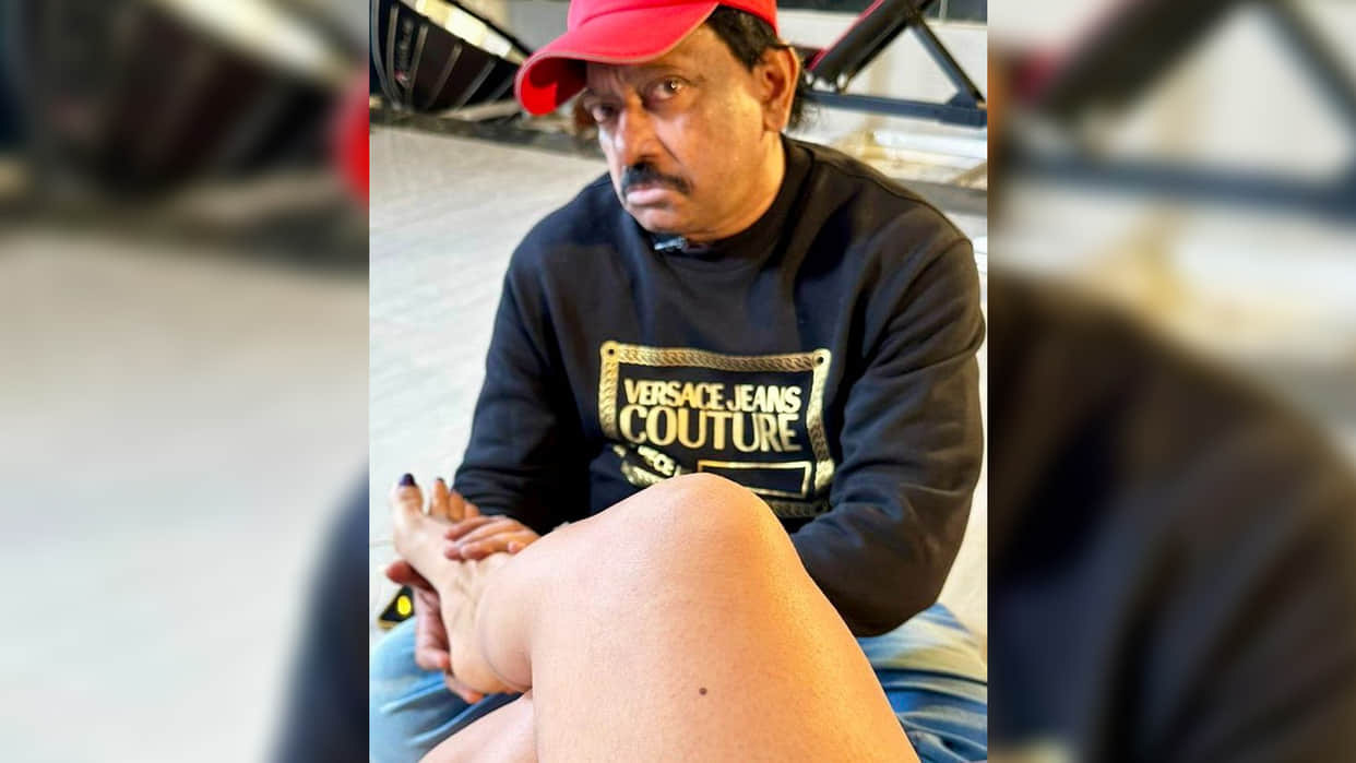 Dangerous Director Ram Gopal Varma kissed actress foot and give massage for film promotion photos goes viral
