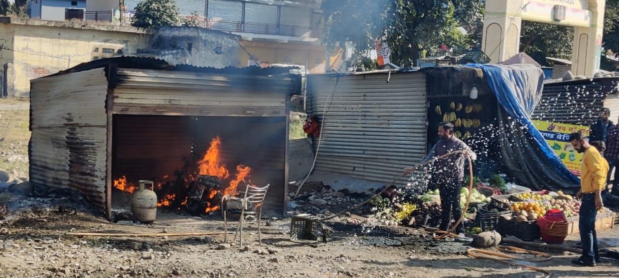 Scooty parked in the story and three gas cylinders burnt