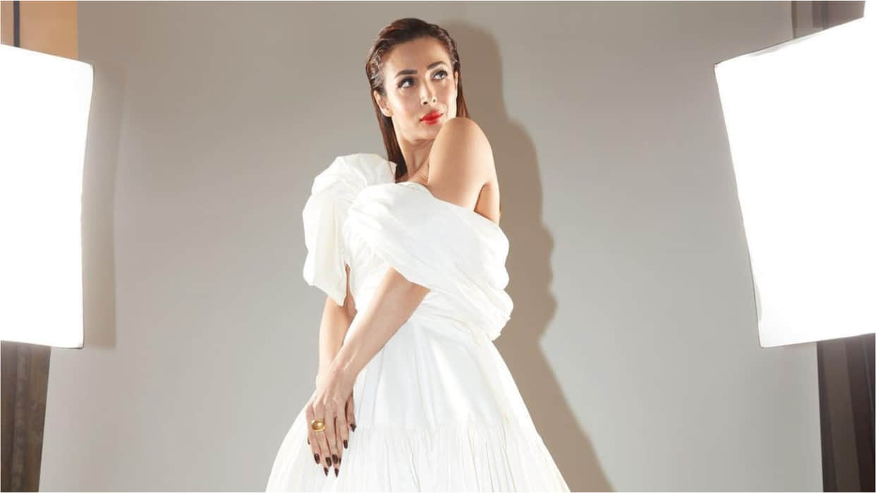 malaika arora nykaa femina beauty award show look in bold red lips with white gown cost can hole your pocket