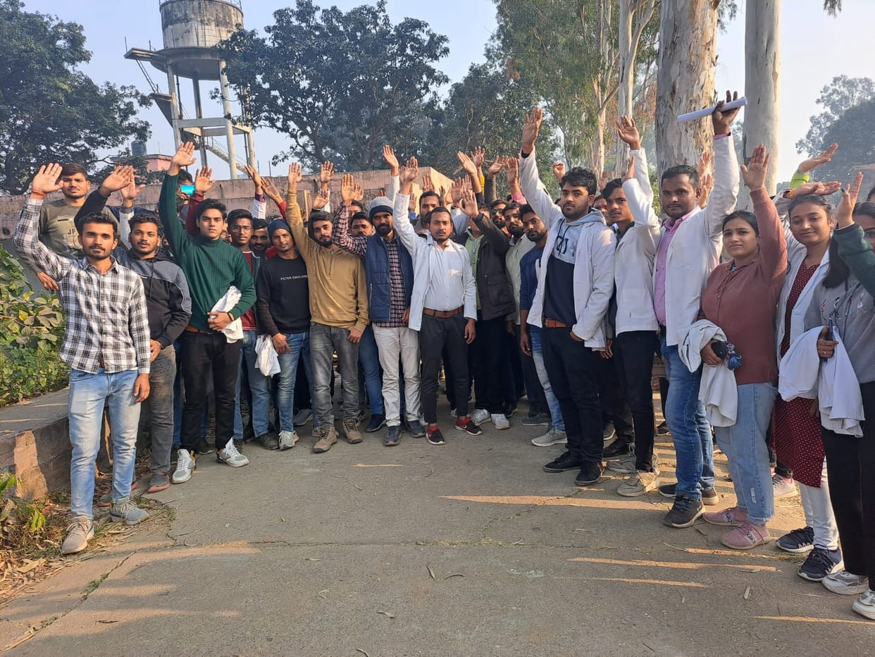 Students lock the gate of Ayurvedic College