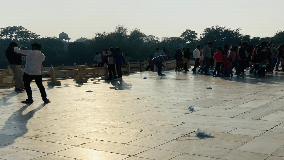 Garbage of shoe cover scattered on the main dome of Taj Mahal