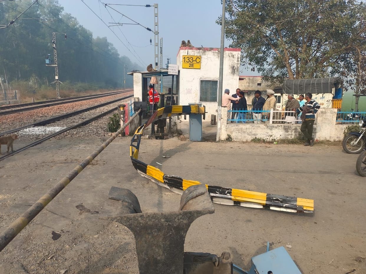 Pickup collided with train breaking railway gate