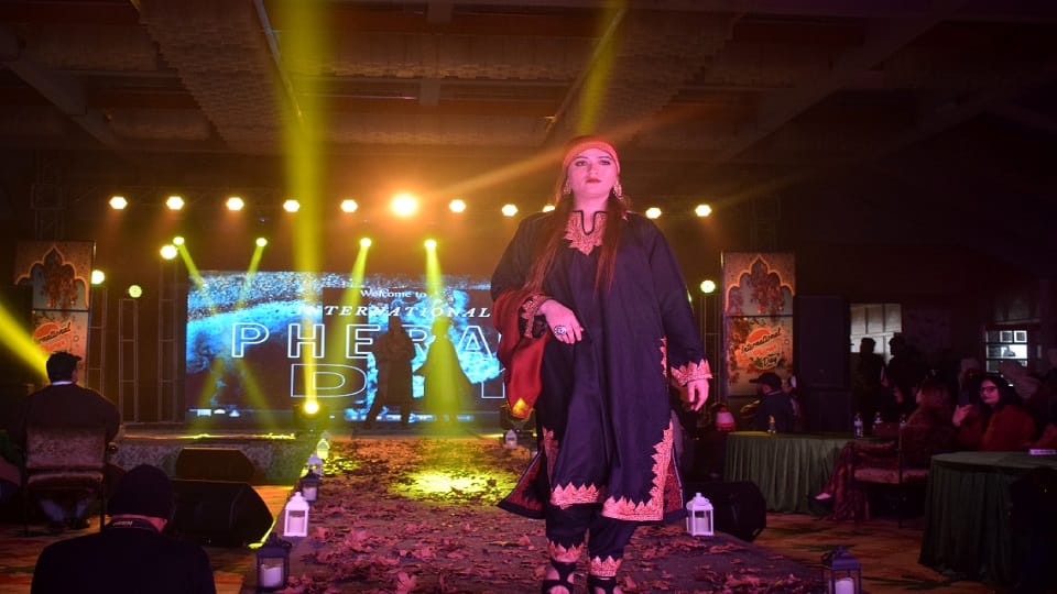 Kashmiri boys and girls walk the ramp wearing Phiran