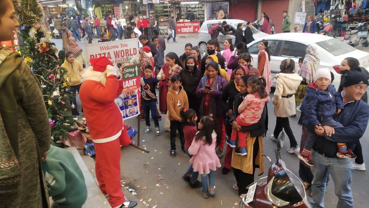 Santa Claus distributed gifts to children and others
