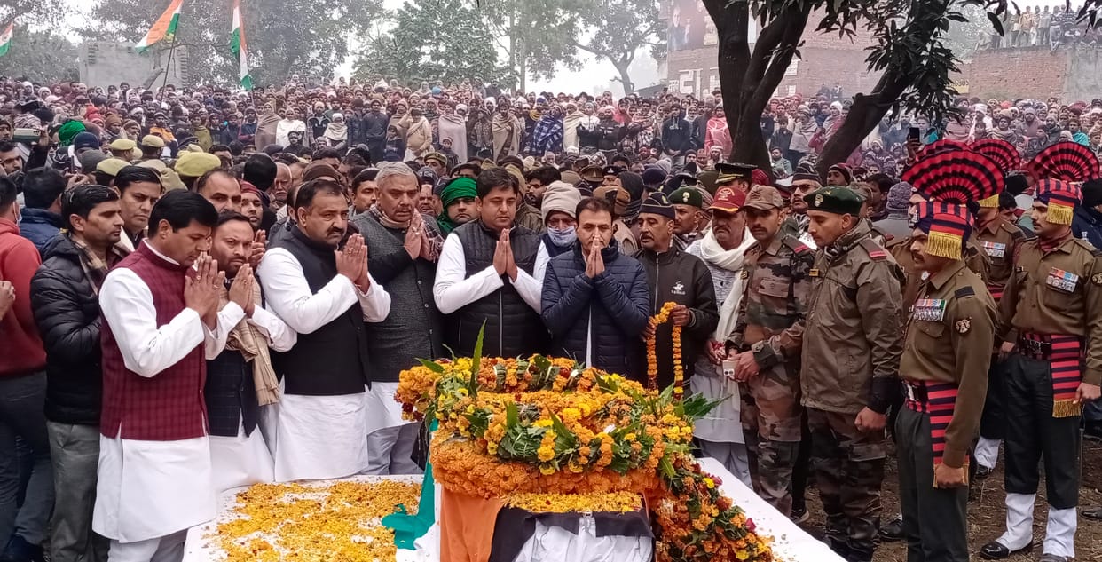 Tears from the eyes and flowers from the hands in the last farewell of the martyr