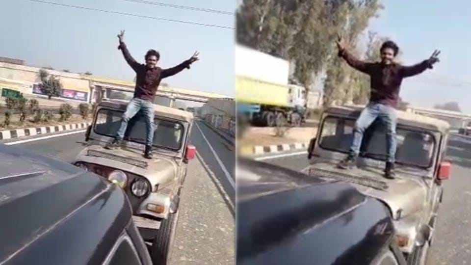 young man made stunt video Standing on bonnet of Thar on highway in Agra