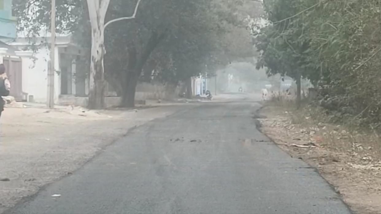 Severe cold starts with January life affected by fog people with the help of bonfire in umaria