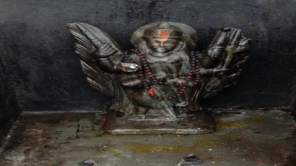 Broken statue of Shani Dev in the temple, new statue installed