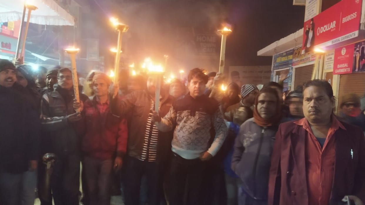 Jain society took out torch procession, protest