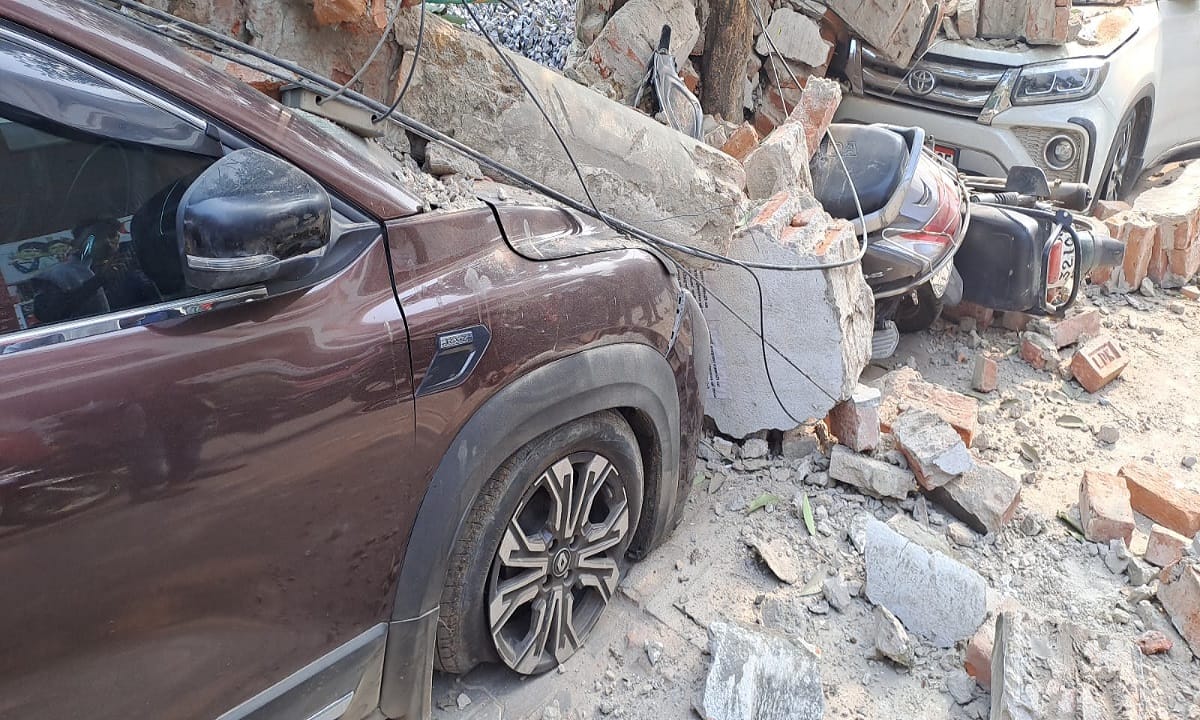 Boundary wall of Sigra Stadium varanasi collapsed two cars 10 scooties and bikes damaged under debris