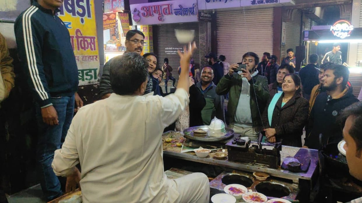 NRI asking Joshiji - How do you bounce a dona filled with curd?