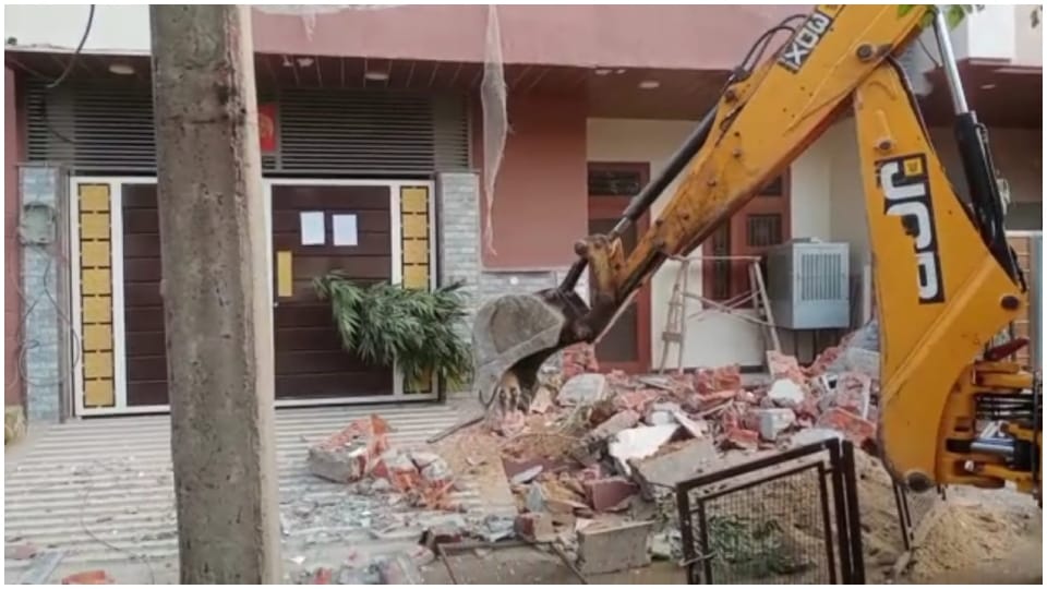 Bulldozer ran at house of Bhupendra Saran master mind of paper leak case in Rajasthan