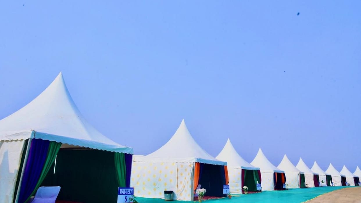 Tent city ready for Magh Mela sit in the lounge of deluxe cottage and see Ganga