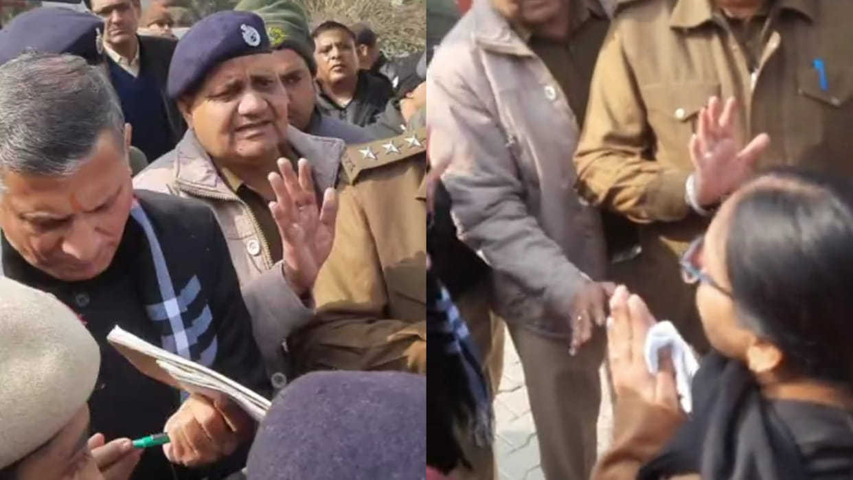 Art teacher folded hands sitting on the ground in front of education minister of Haryana