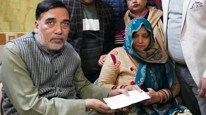 Gopal Rai handing over the check