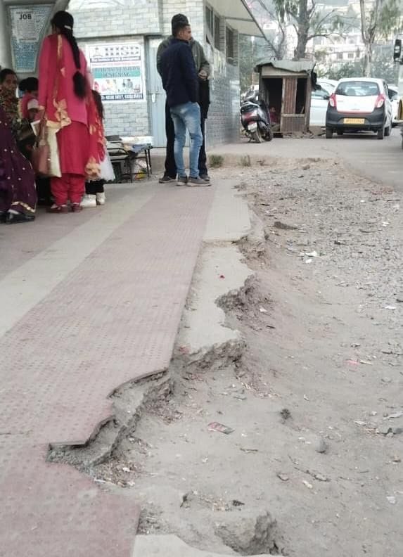 Varsha Shalika tiles broken at Dharampur bus stop