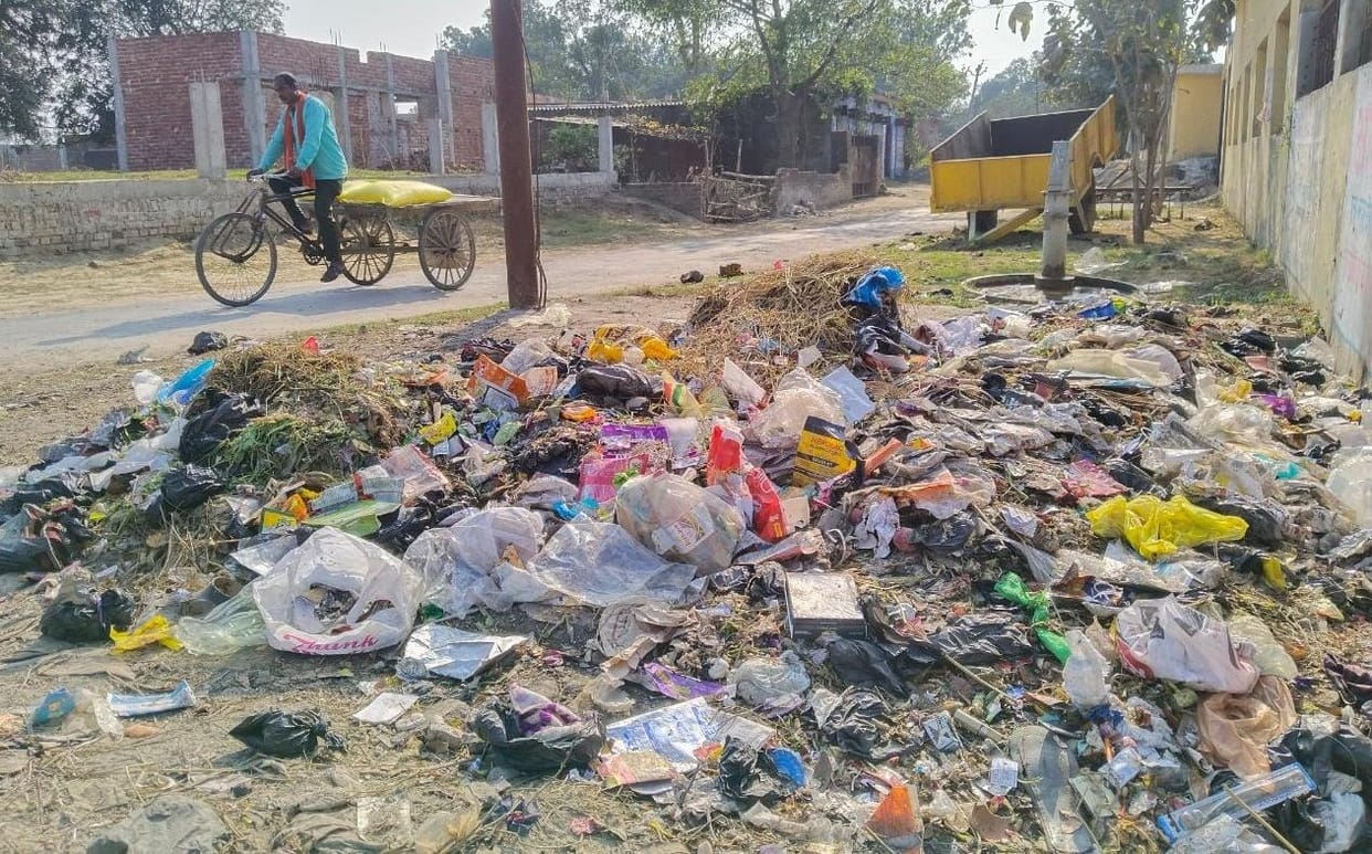 Garbage disposal center made still garbage being thrown on road