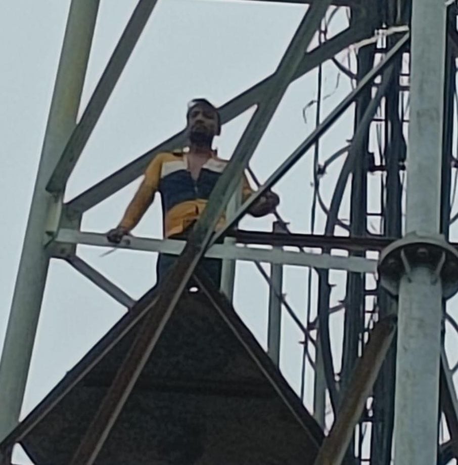 young boy climb on tower