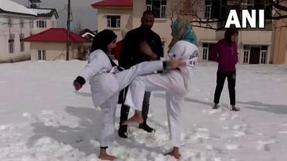 Jammu Kashmir: Girl learning martial arts tricks barefoot in the snow in Budgam