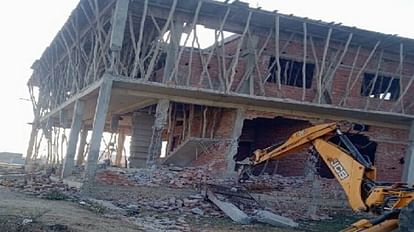 VDA in action Bulldozer run on under construction building  in Ramnagar varanasi