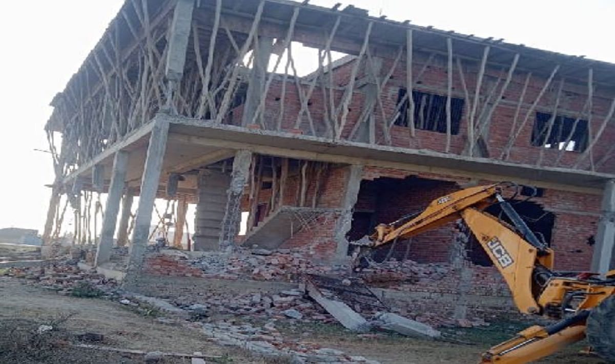 VDA in action Bulldozer run on under construction building  in Ramnagar varanasi