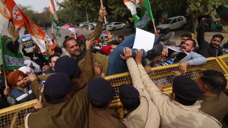 Chandigarh Youth Congress workers protest against Adani Group outside Congress building in Sector 35