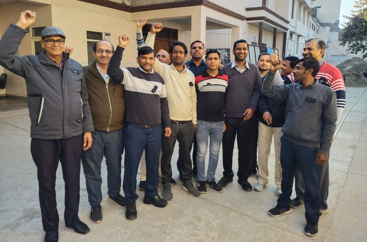 Employees of aided colleges protested by tying black bands