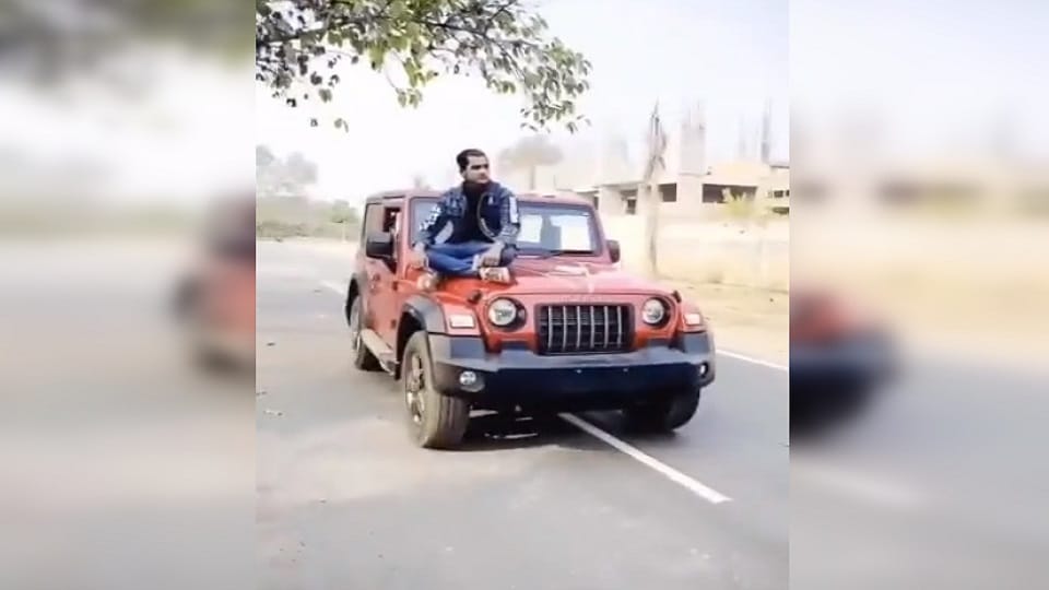 police arrested a young man who did stunts sitting on bonnet of Thar In Moradabad