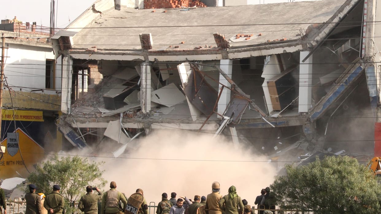 Two storey showroom demolished in Malik Market Jammu city