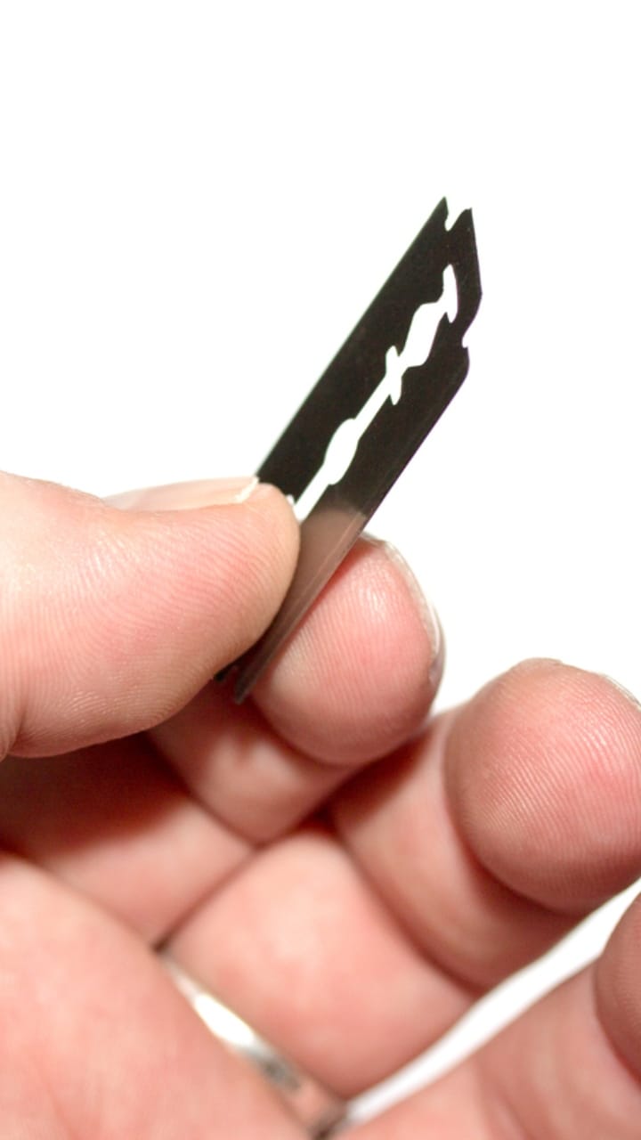 Slit his wife and then his own throat with a blade, both admitted to hospital