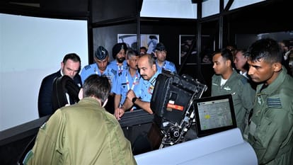Indian Air Chief Marshal VR Chaudhari visited various aerospace sector stalls on display in Aero India