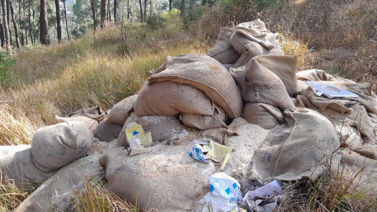 Show cause notice to cooperative society for throwing grains in the forest