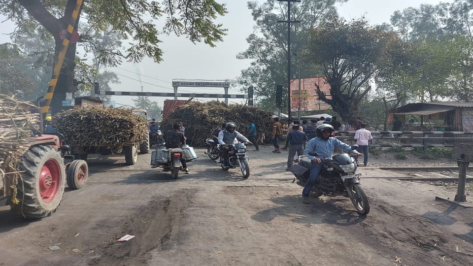 overloaded truck with sugarcane split into two parts on rail track in bareilly