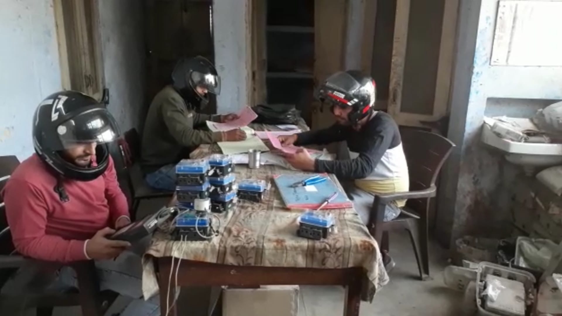Employees working in office wearing helmet due to fear of death in Baghpat