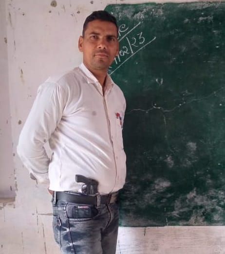 Shikshamitra teaching children with revolver in class BO handed over notice