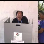 मतदान करते नगालैंड के मुख्यमंत्री रियो और लाइन में खड़े मेघालय के सीएम संगमा।