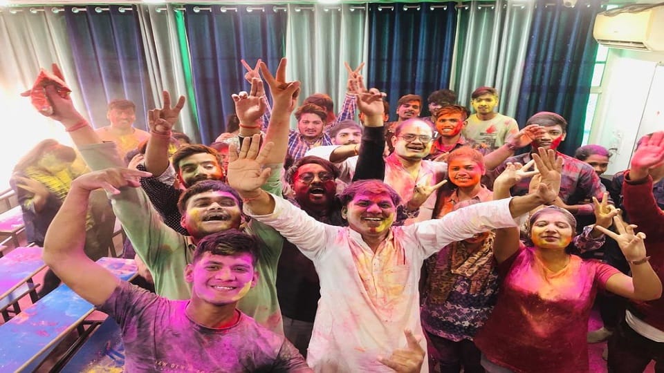 Teachers and students congratulated Holi by applying gulal