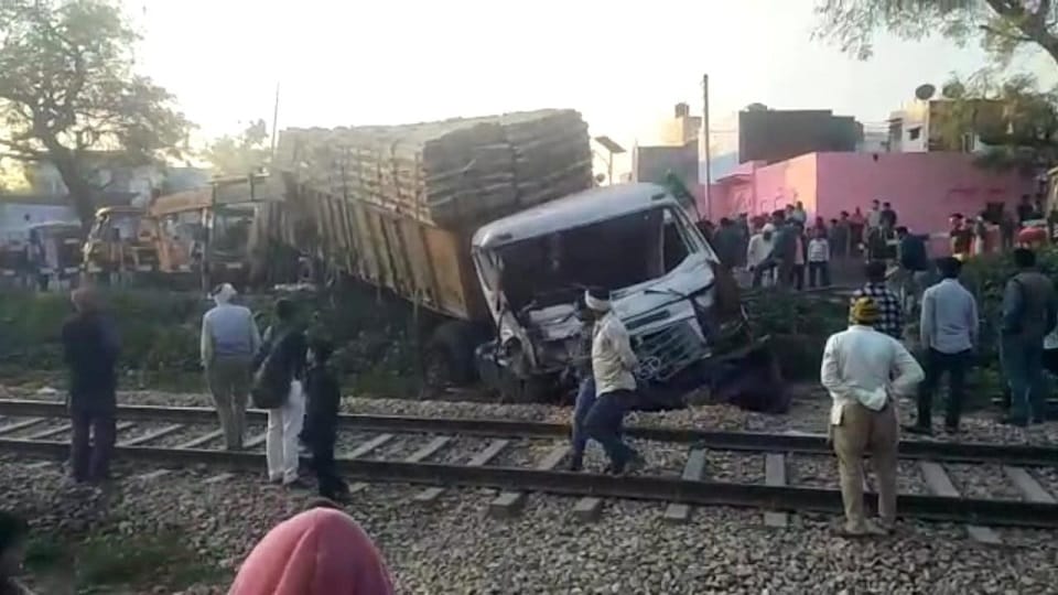 Truck hit tractor trolley and entered the rail track one injured