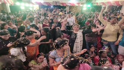 Devotees play Holi with flowers at Khatu Shyam Ji Temple in Agra