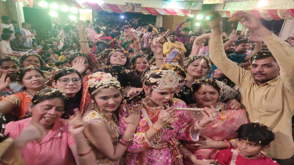 Devotees play Holi with flowers at Khatu Shyam Ji Temple in Agra
