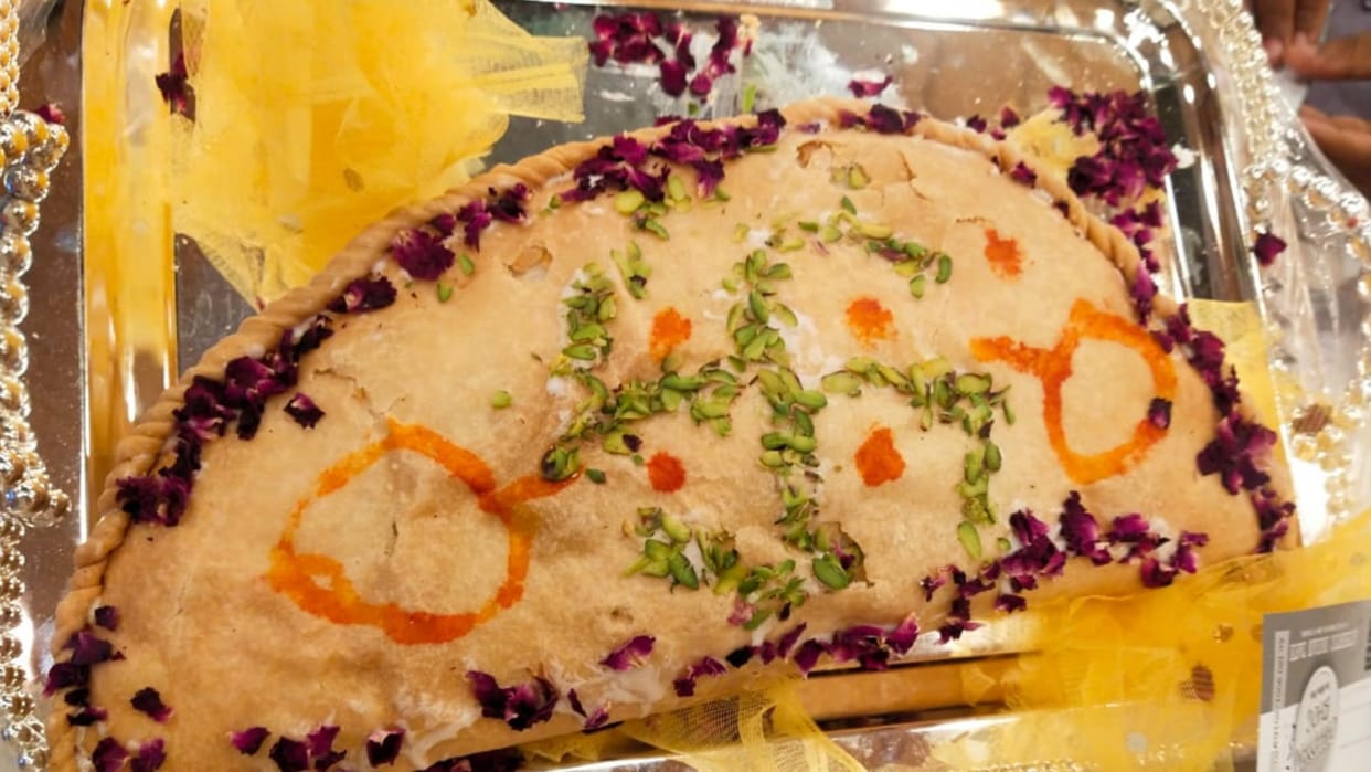Eating big Gojiya on Holi.