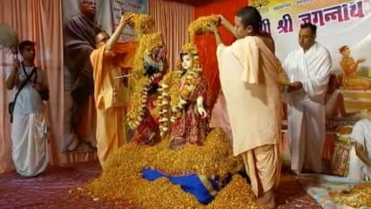 Devotees play Holi of flowers with Radha-Krishna at Shri Jagannath Temple in Agra