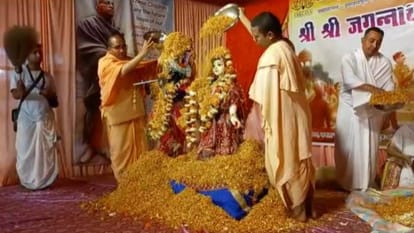 Devotees play Holi of flowers with Radha-Krishna at Shri Jagannath Temple in Agra