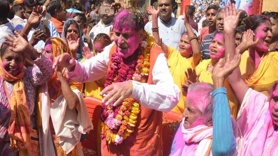 widows and destitute mothers played Holi of colors in Radha Gopinath temple In Vrindavan at mathura