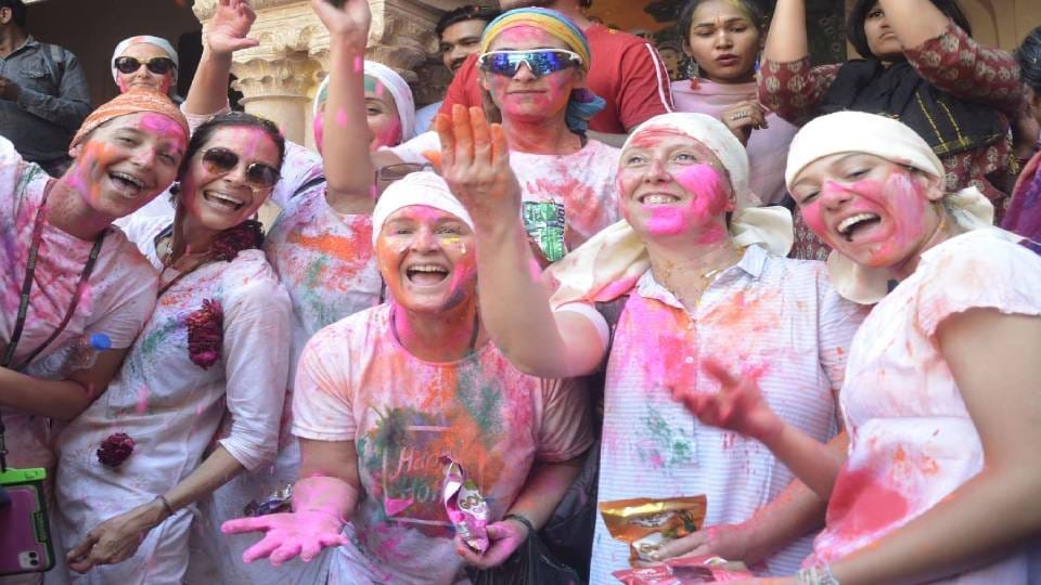 widows and destitute mothers played Holi of colors in Radha Gopinath temple In Vrindavan at mathura